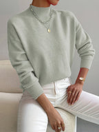 Light green women’s crew-neck sweater with ribbed cuffs and hem