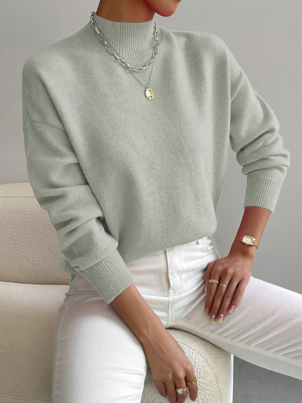 Light green women’s crew-neck sweater with ribbed cuffs and hem