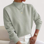 Light green women’s loose-fit sweater, crew neck, long sleeves, ribbed cuffs and hem.