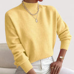 Yellow women’s loose-fit sweater, crew neck, long sleeves, ribbed cuffs and hem.