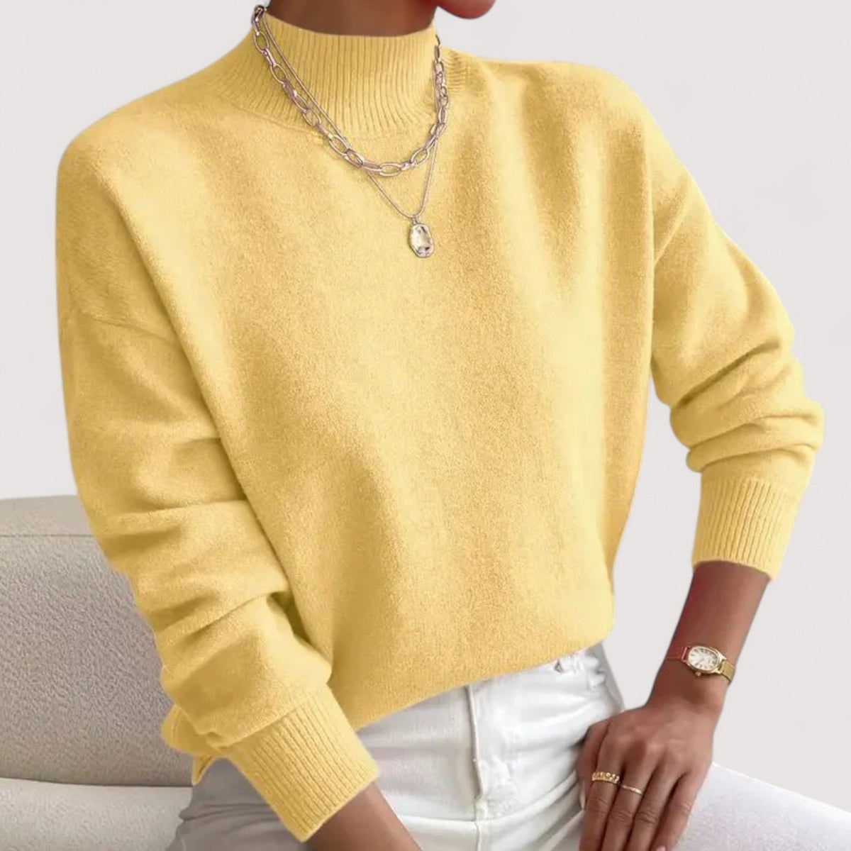 Yellow women’s loose-fit sweater, crew neck, long sleeves, ribbed cuffs and hem.