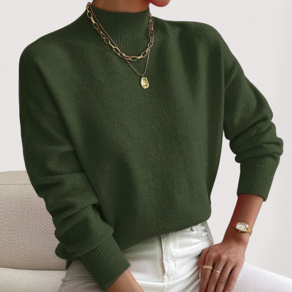 Green women’s loose-fit sweater, crew neck, long sleeves, ribbed cuffs and hem.
