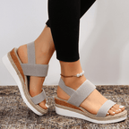 Grey platform sandals with elastic ankle and toe straps, textured jute-look sole