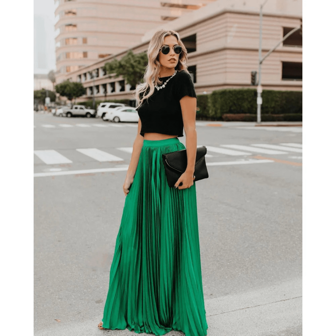Vivid green pleated maxi skirt with elastic waistband and flowing A-line silhouette