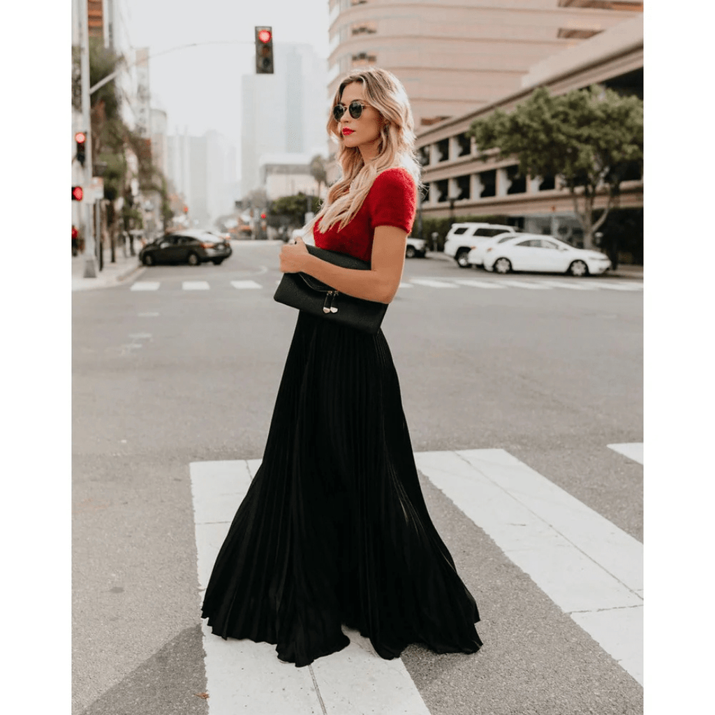Black pleated maxi skirt with elastic waistband and flowing A-line drape