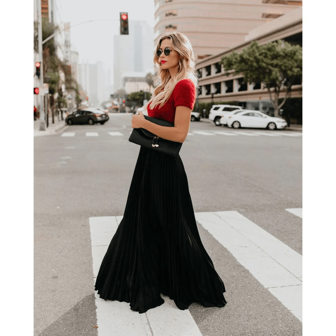 Black pleated maxi skirt with elastic waistband and flowing A-line drape