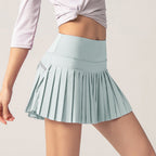 Light blue tennis skirt with pleated A-line hem and elastic waistband