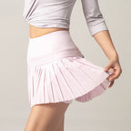 Light pink tennis skirt with pleated A-line hem and elastic waistband