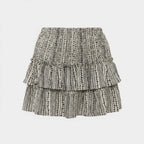 Black-and-white patterned tiered mini skirt with elastic waistband