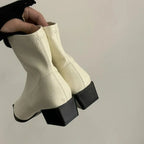 Cream pointed-toe ankle boots with tapered design and chunky block heels