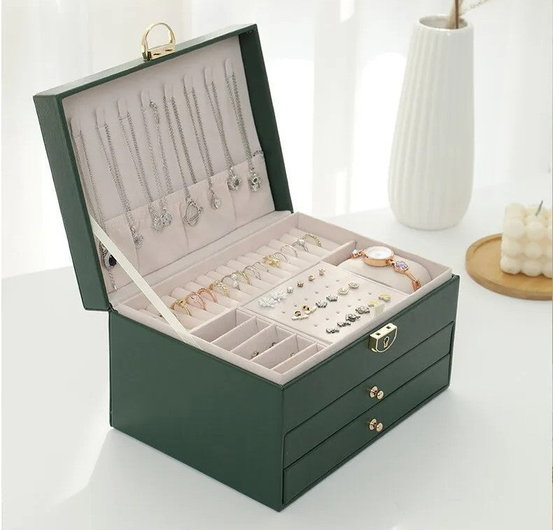 Green leather jewelry box open with necklace hooks and ring display tray