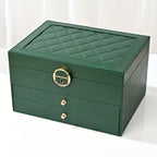 Green leather multilayer jewelry box, quilted lid with gold lock and key charm
