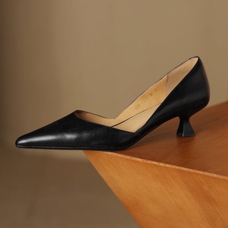 Black pointed-toe kitten heels with slim low heel and curved topline