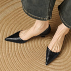 Black pointed-toe kitten heels, low block heel and smooth uppers