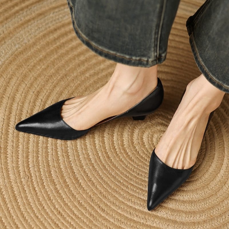 Black pointed-toe kitten heels, low block heel and smooth uppers