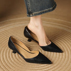 Black pointed-toe kitten heels with low block heel and smooth upper