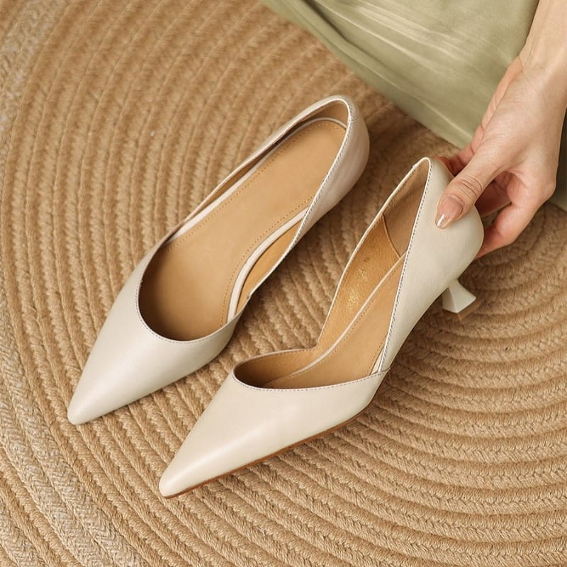 Cream pointed-toe kitten heels with low block heel and smooth upper