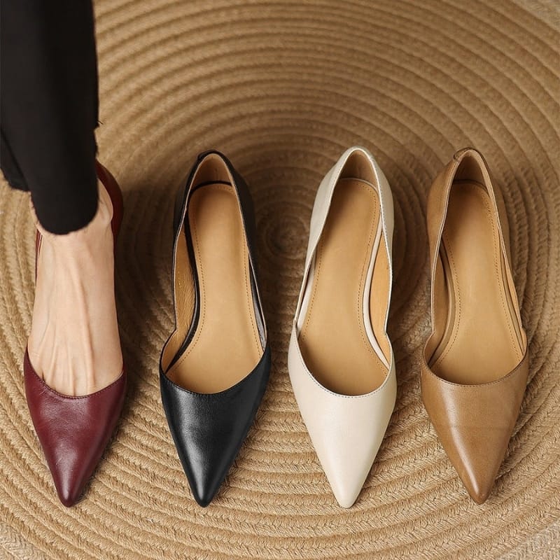 Pointed-toe kitten heels in maroon, black, white, and tan with low block heels