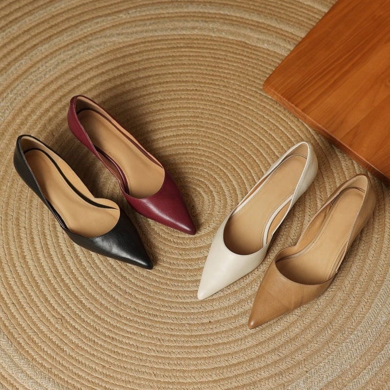 Pointed-toe kitten heels in maroon, black, white, and tan with low block heels