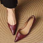Maroon pointed-toe kitten heels with low block heel and smooth leather-look upper