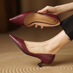 Maroon pointed-toe kitten heels with low block heel and smooth finish