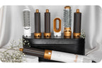 Hair dryer brush styler set with gold barrels, round brush heads, and storage case