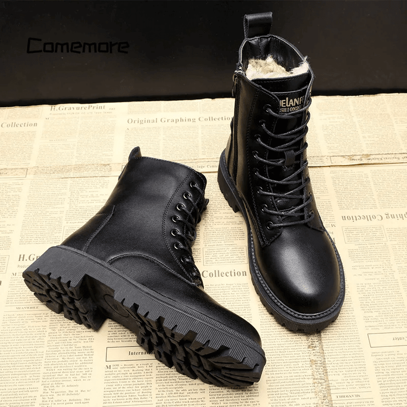 Black lace-up winter ankle boots with rounded toe and chunky tread sole