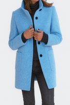 Women’s straight-cut button-front coat in light blue with notch collar and patch pockets.