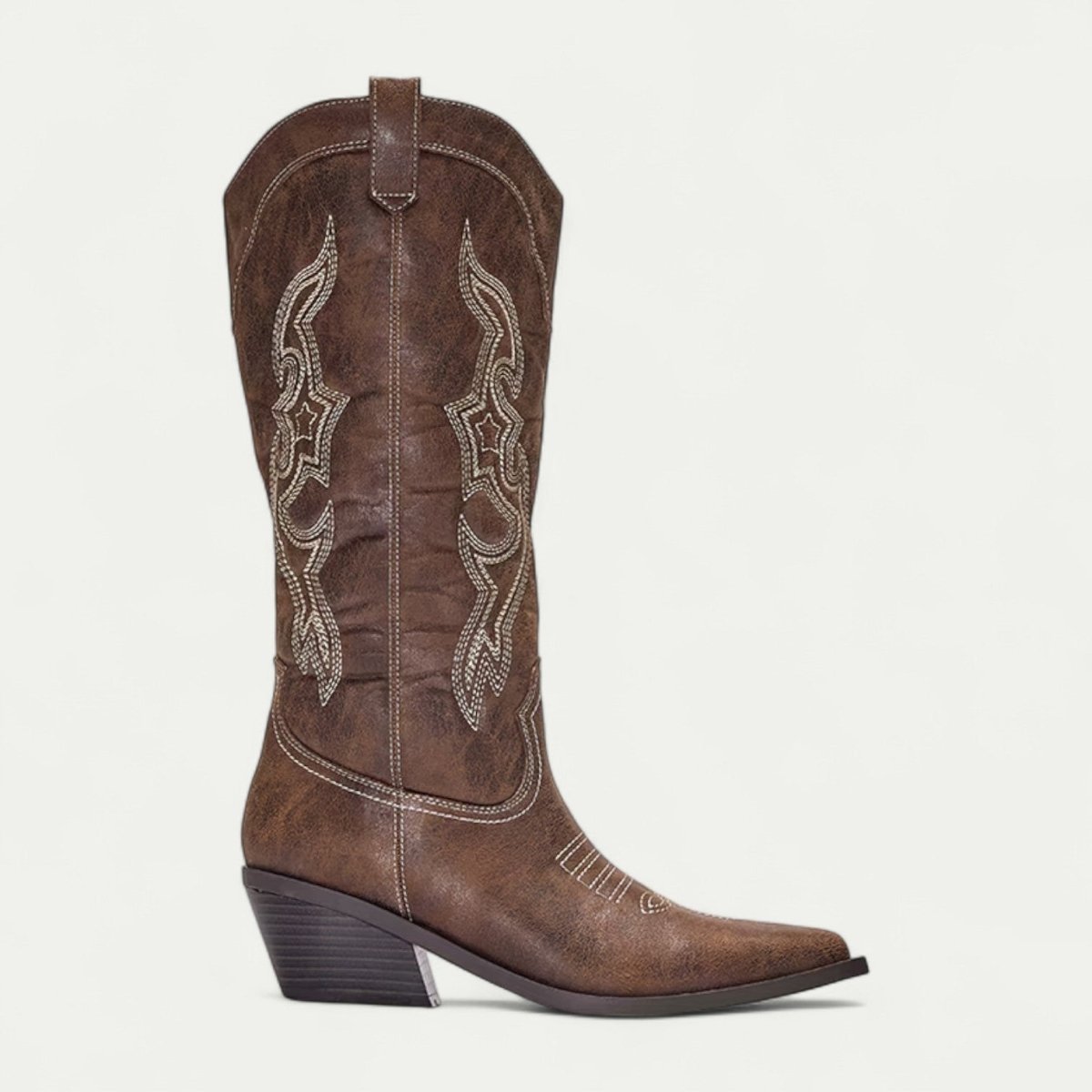 Women's brown suede western boots with stitched swirl panels and stacked heel
