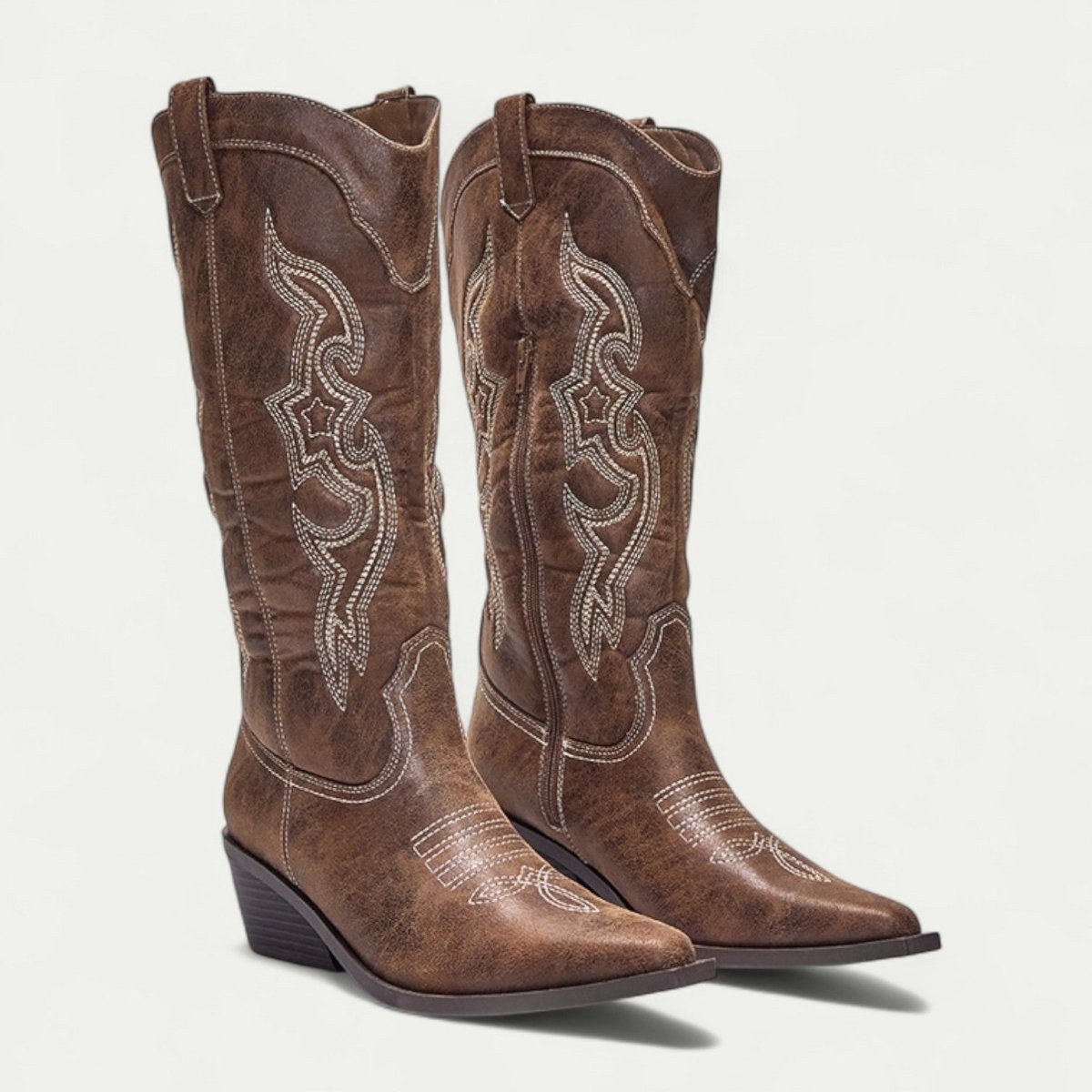 Women's brown suede western boots, pair view, pointed toe with decorative stitched trim