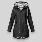 Black women’s hooded parka with striped hood lining, full zipper, and waist drawstrings.