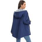 Navy blue women’s parka with hood, full zipper, and adjustable drawstring waist.