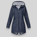 Navy blue women’s insulated parka with striped hood lining and double front zips.