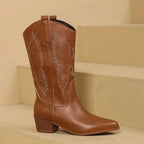 Women’s embroidered pointed-toe cowgirl boots in brown with block heel and leaf-style embroidery.