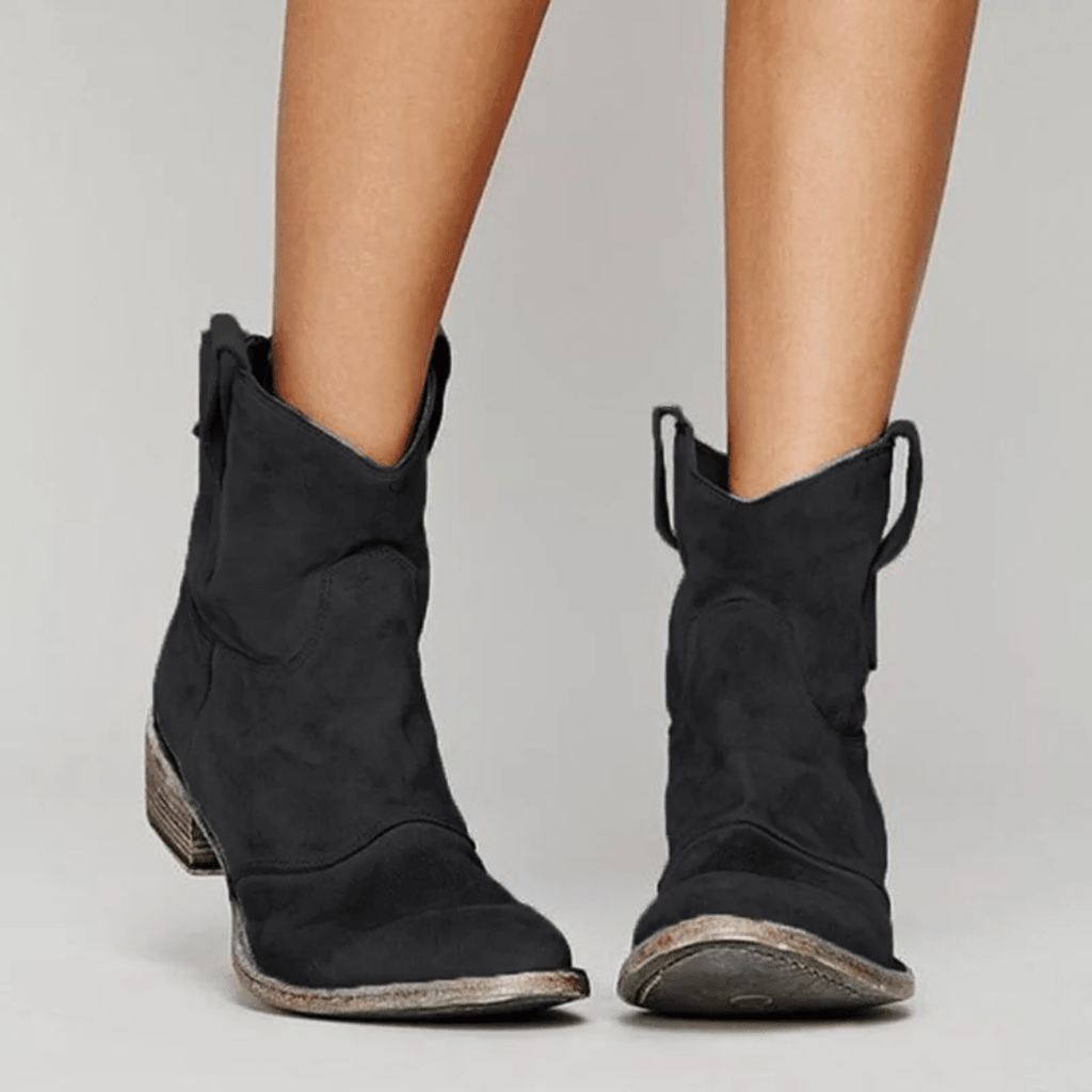 Women’s low-heel slip-on ankle boots in black suede with side pull tabs