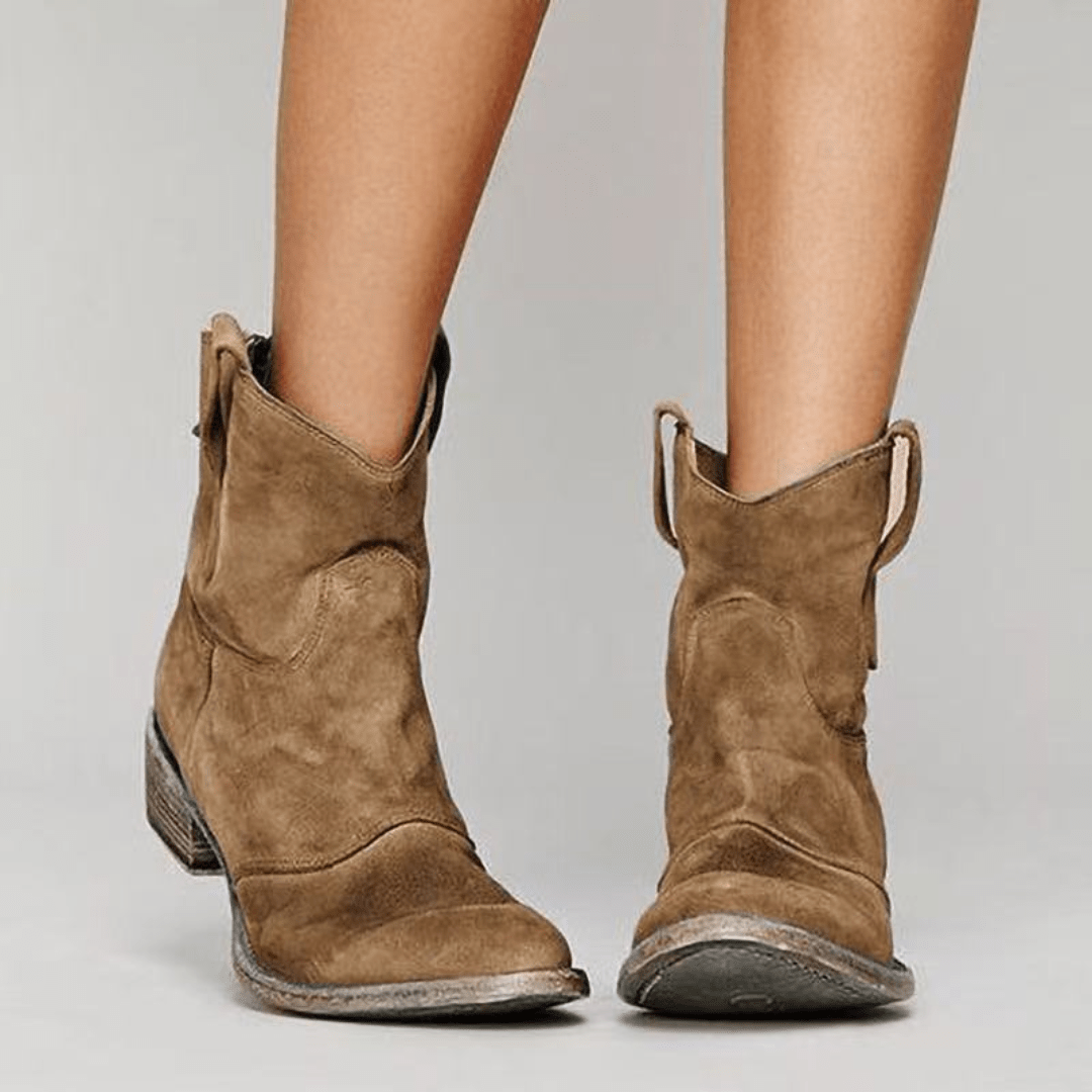 Women’s low-heel slip-on ankle boots in brown suede with pull tabs and low heel