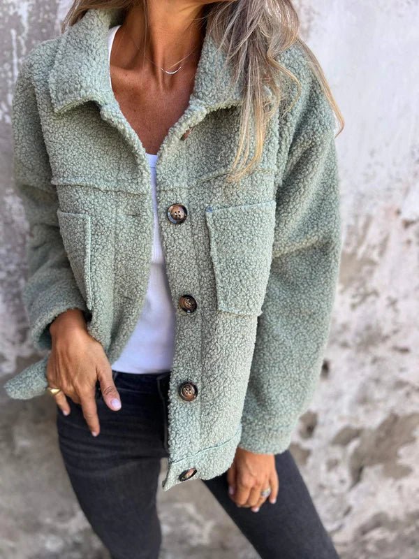 Light green sherpa cardigan with collared neckline, button front, and flap pockets