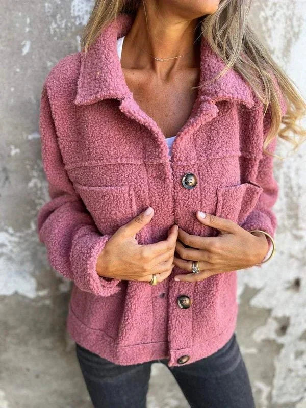 Pink sherpa cardigan with collared neckline, button front, and flap chest pockets
