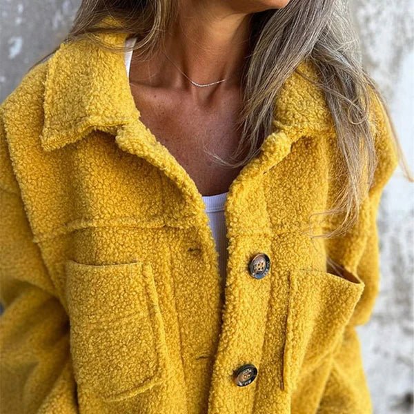Yellow collared cardigan with button front and flap pockets in textured fuzzy fabric