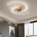 Flush-mount LED ceiling lamp with gold center and radiating slim light bars