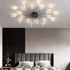 Black LED flush mount ceiling lamp with radial slim arms and glowing bulbs