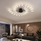 Black LED flush mount ceiling lamp with radial rod arms and glowing bulbs on ceiling