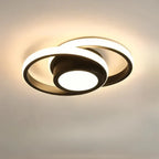 Circular double ring LED flush mount ceiling light, glowing white rings over black base