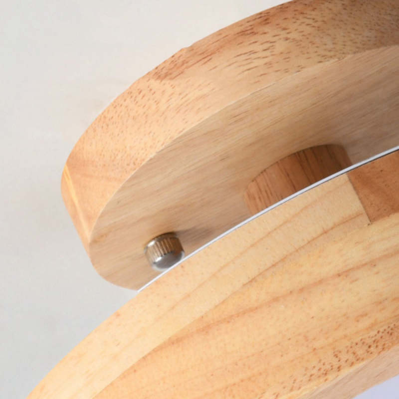 Wood flush mount ceiling lamp close-up showing mounting plate and screws