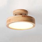 Wood flush mount LED ceiling lamp with warm glowing circular diffuser and wood base