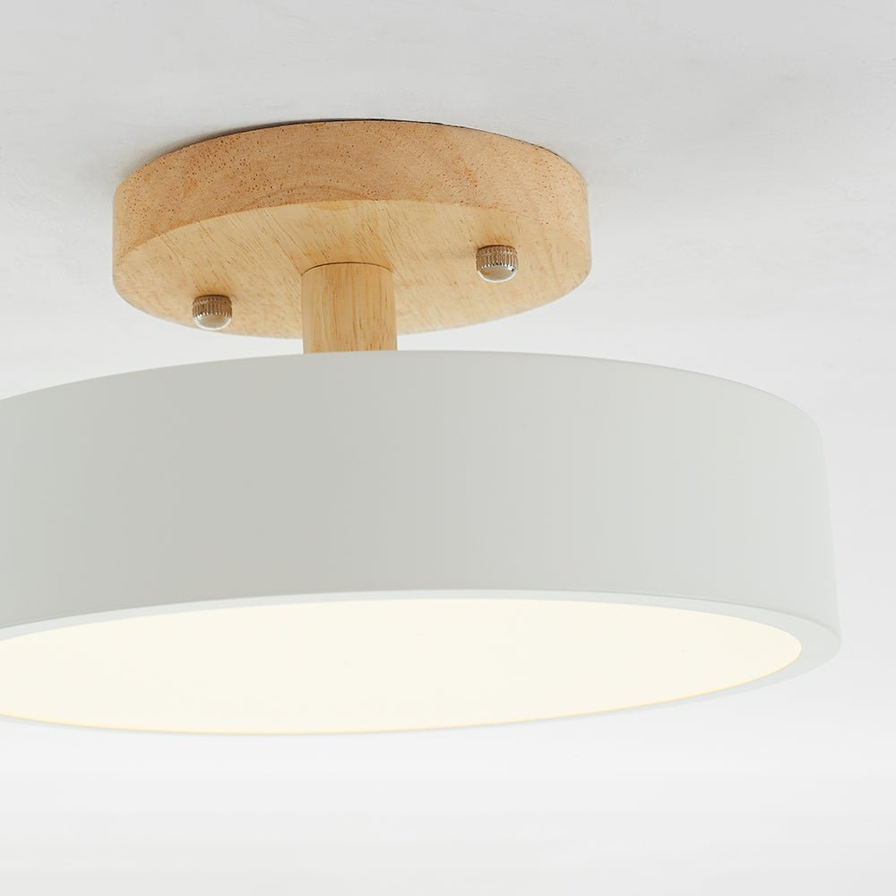 LED flush mount ceiling lamp with wood base and white acrylic diffuser, warm glow
