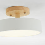 LED flush mount ceiling lamp with wood base and white acrylic diffuser, warm glow