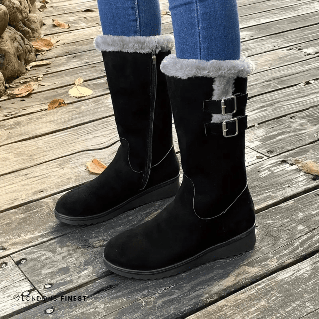 Mid-calf black boots with faux-fur cuff and side double buckles