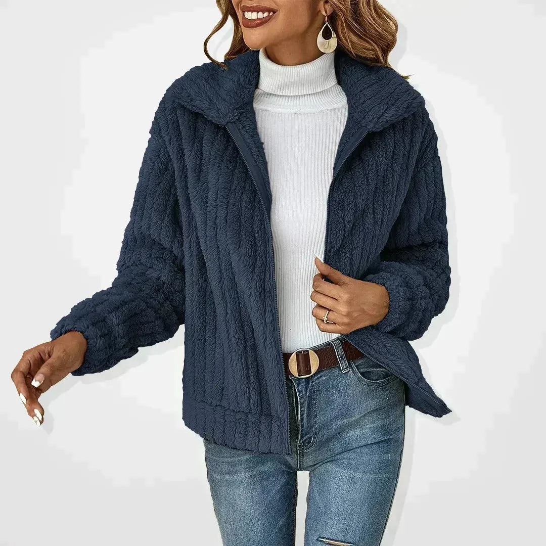 Dark blue textured zip-front women’s jacket with stand collar and long sleeves