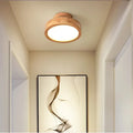 Round solid-wood flush mount ceiling lamp with LED glow and layered wood rim